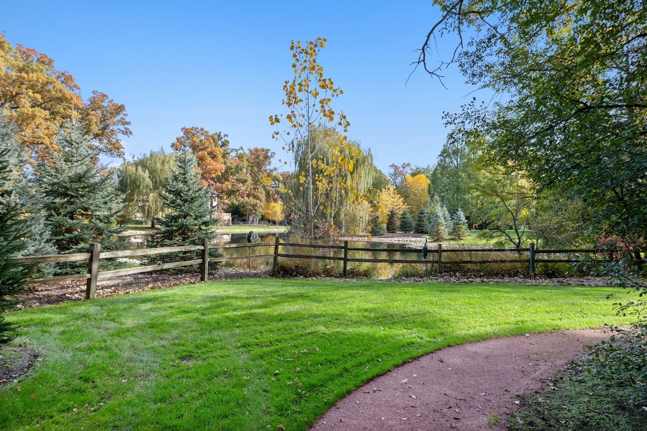 Beautifully Appointed Home in a Gated Community on Over an Acre of Professionally Landscaped Grounds with Pond Views