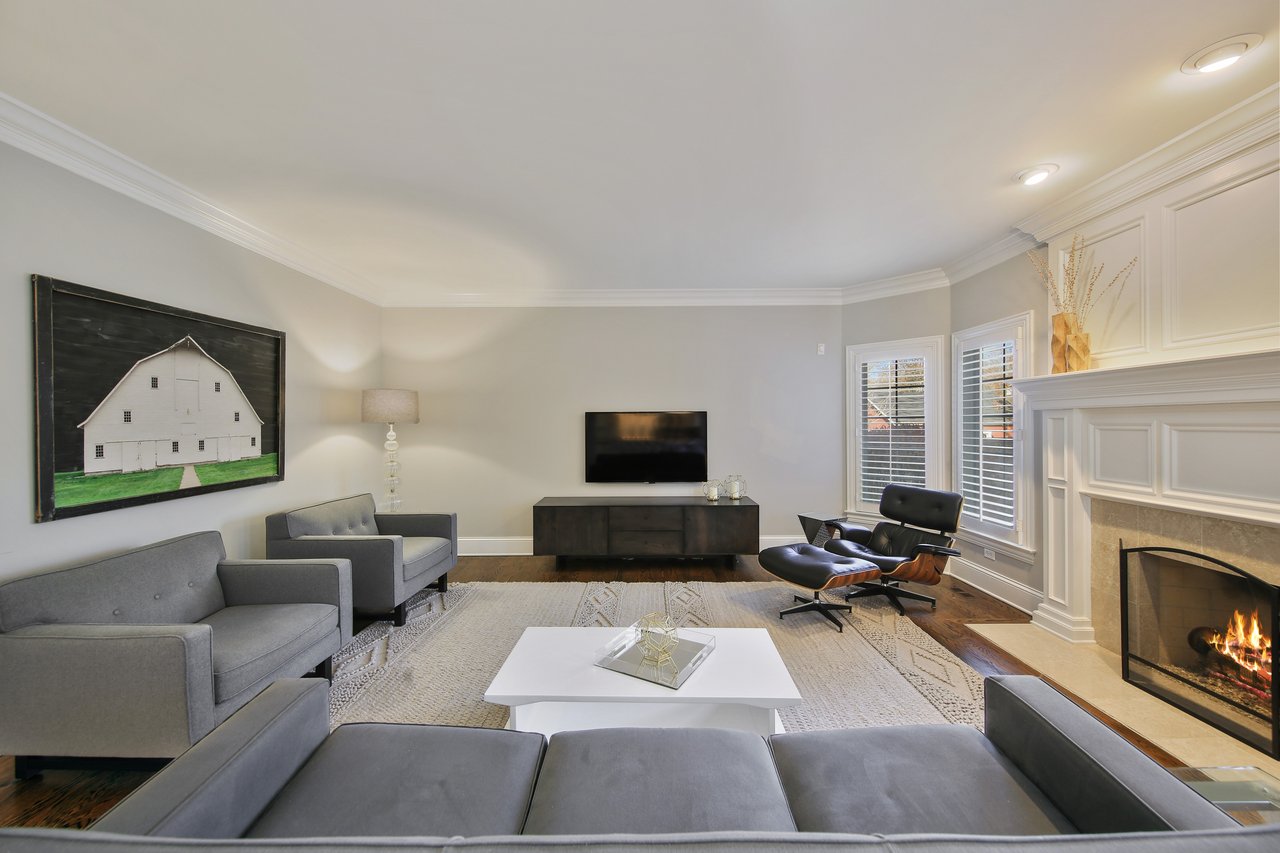 The Tree-lined Street And A Perfectly Manicured Yard Welcome You To The Entry Of The Home