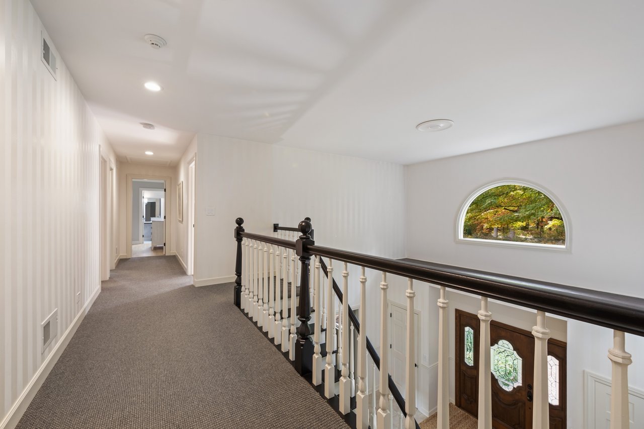 Beautifully Appointed Home in a Gated Community on Over an Acre of Professionally Landscaped Grounds with Pond Views