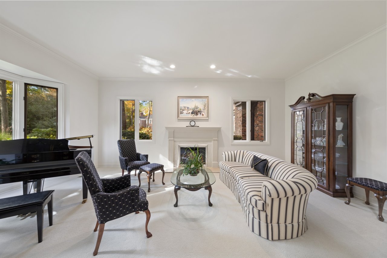 Beautifully Appointed Home in a Gated Community on Over an Acre of Professionally Landscaped Grounds with Pond Views