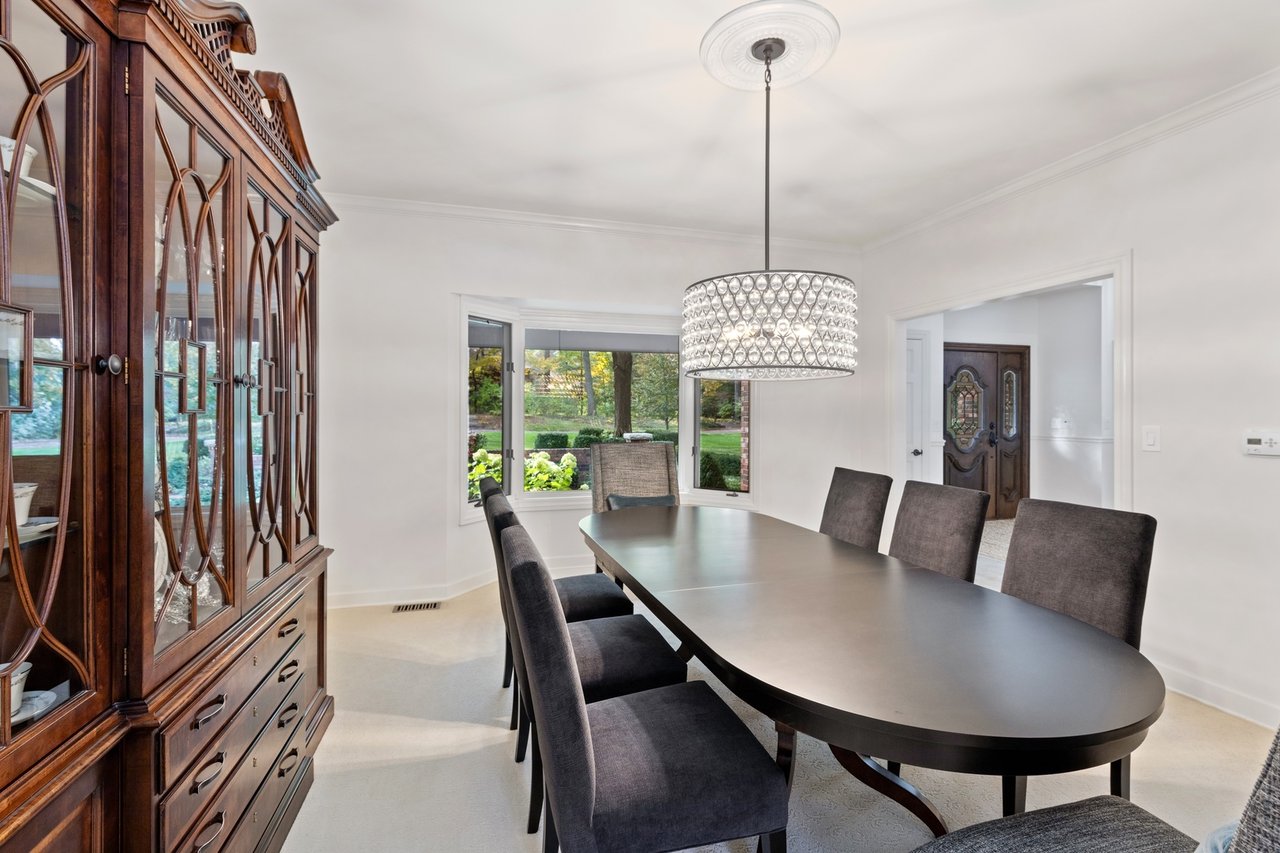 Beautifully Appointed Home in a Gated Community on Over an Acre of Professionally Landscaped Grounds with Pond Views