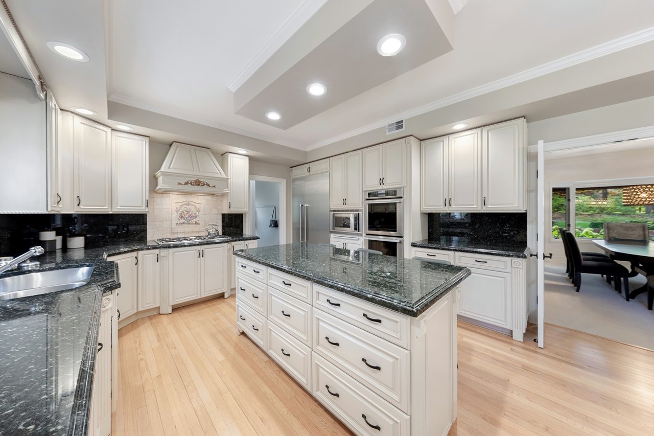 Beautifully Appointed Home in a Gated Community on Over an Acre of Professionally Landscaped Grounds with Pond Views