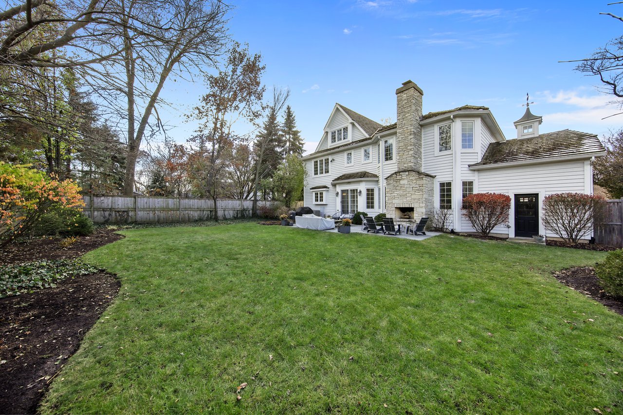 The Tree-lined Street And A Perfectly Manicured Yard Welcome You To The Entry Of The Home