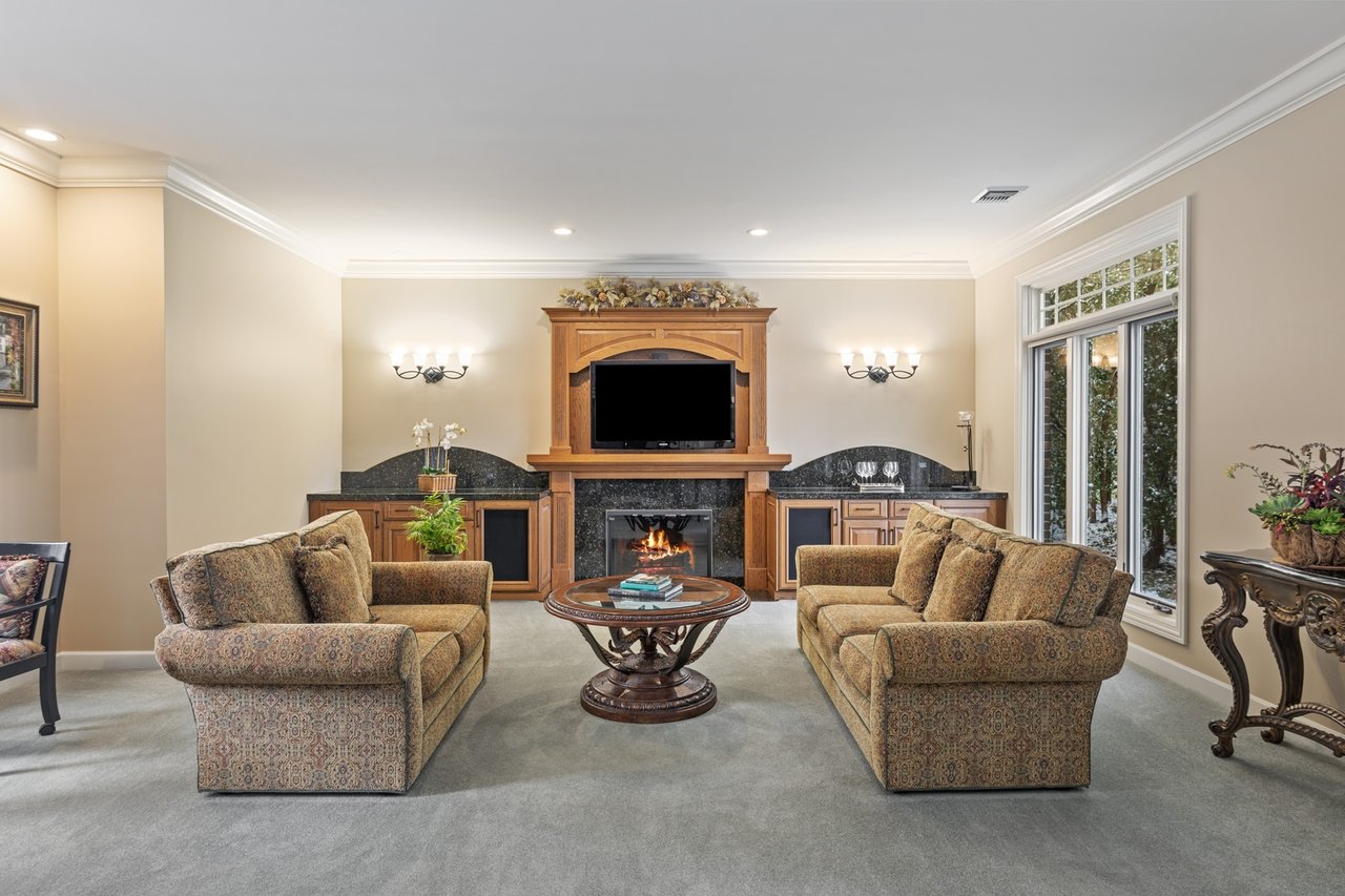 Beautifully Appointed Home in a Gated Community on Over an Acre of Professionally Landscaped Grounds with Pond Views