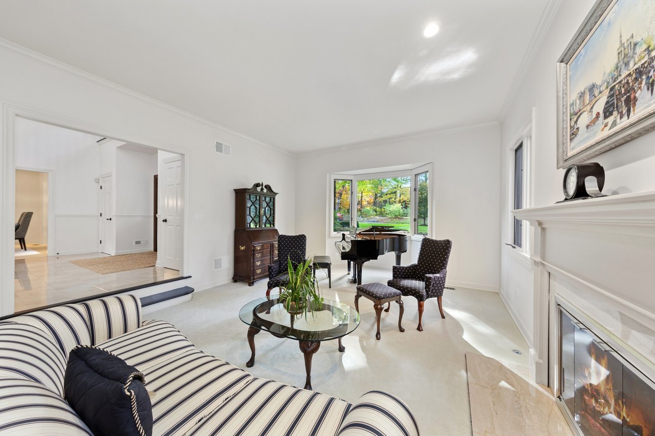 Beautifully Appointed Home in a Gated Community on Over an Acre of Professionally Landscaped Grounds with Pond Views