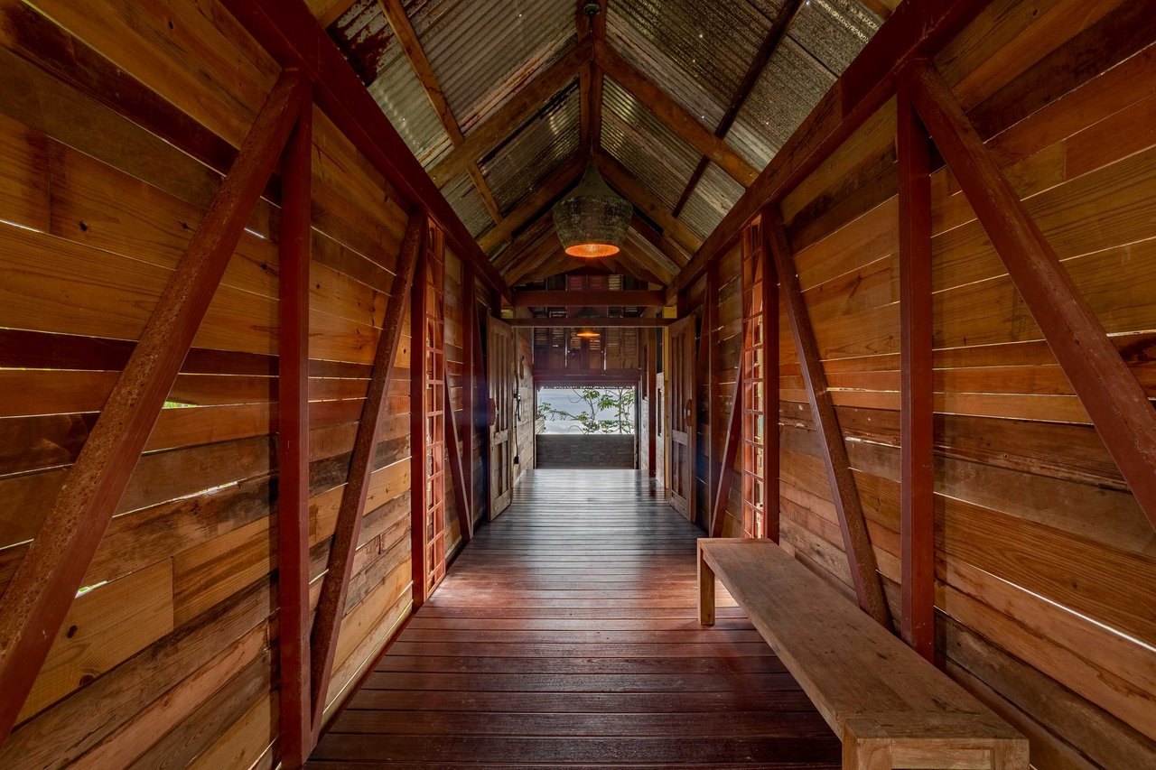 A Handcrafted Residence Immersed in Nature Above the Canopy Ocean View Architectural Home