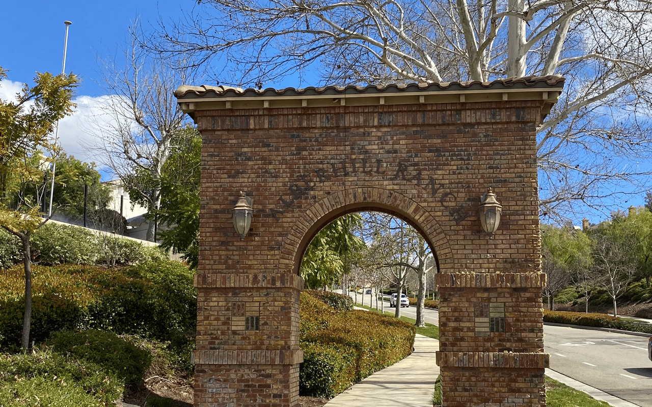 Stone arch entry monument to a master-planned neighborhood in Lake Elsinore, California.