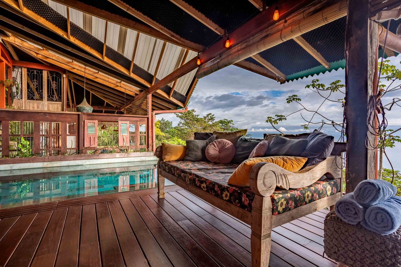 A Handcrafted Residence Immersed in Nature Above the Canopy Ocean View Architectural Home