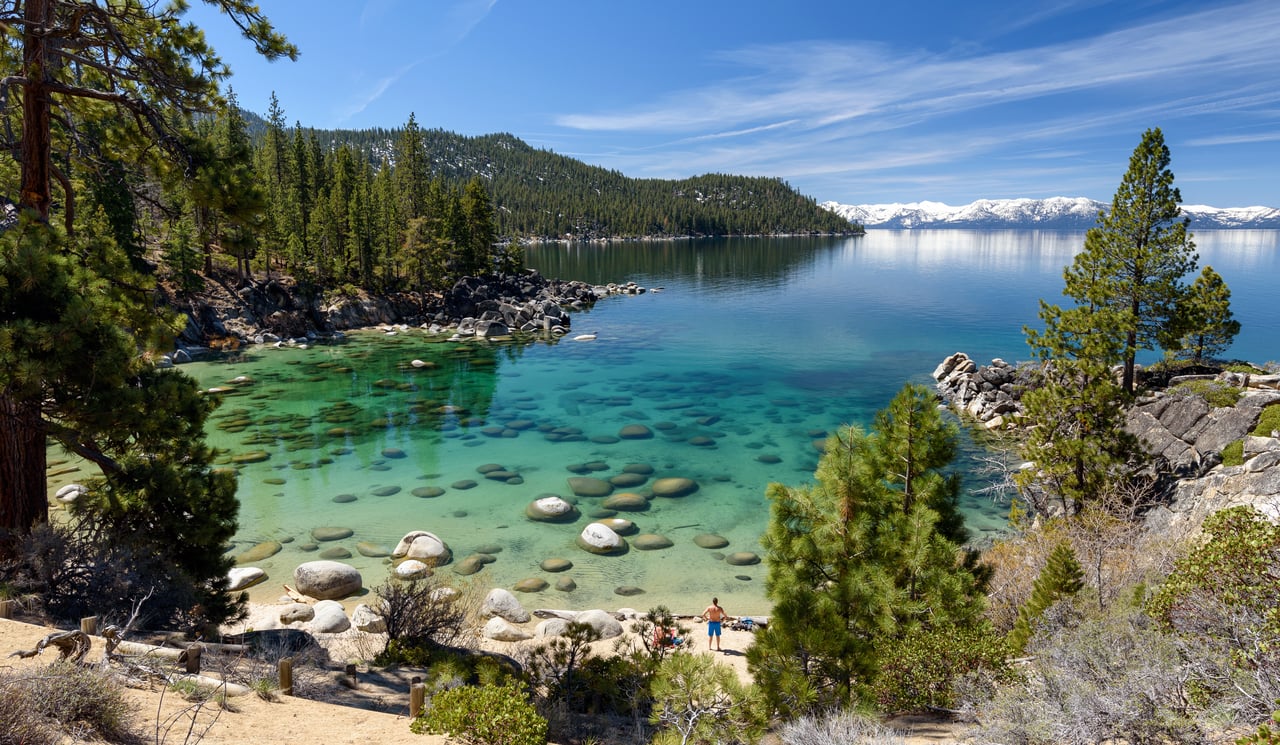 Scenic view of Lake Tahoe homes near the shoreline, ideal for short-term rental investment