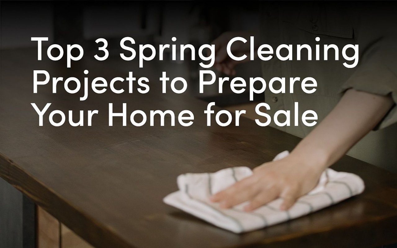 Top 3 Spring Cleaning Projects to Prepare Your Home for Sale, over a person wiping a wooden table.