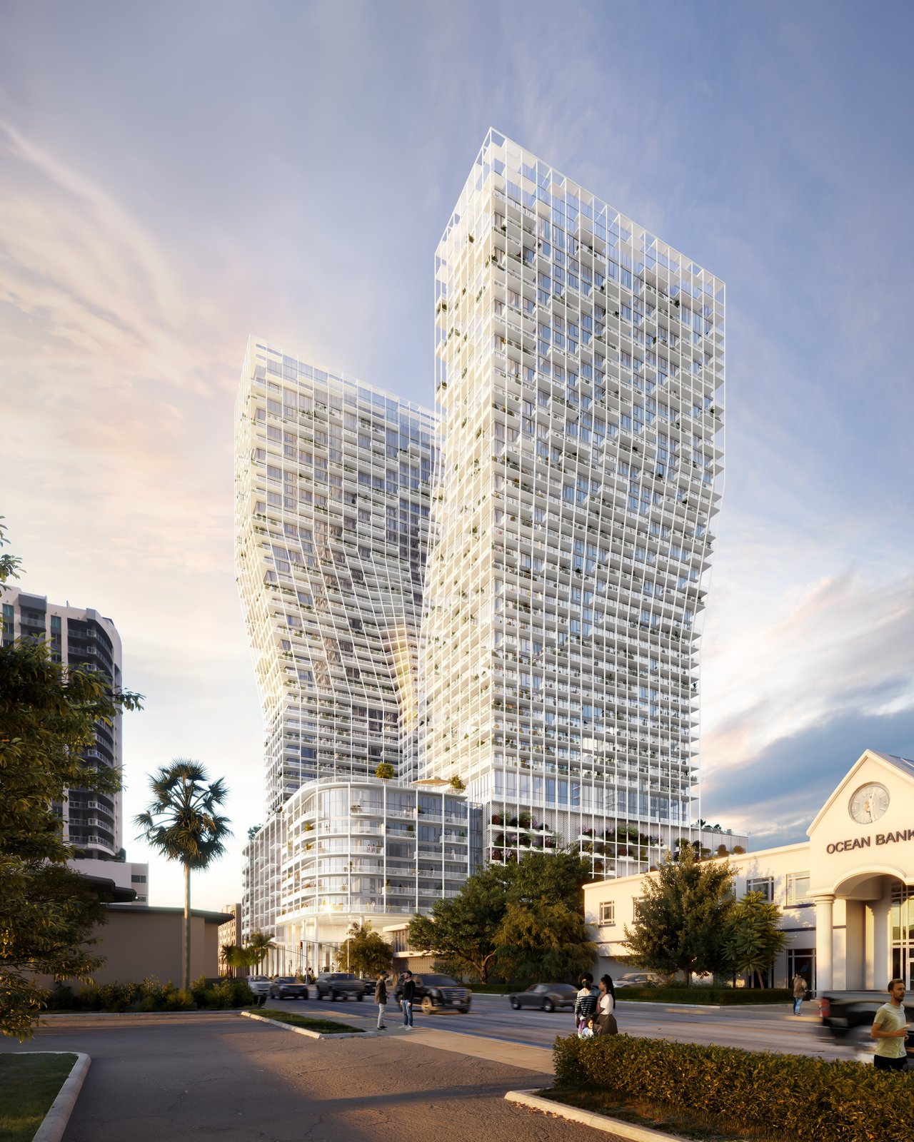 Architectural rendering of Ombelle’s residential towers above a street with trees and pedestrians at golden hour.