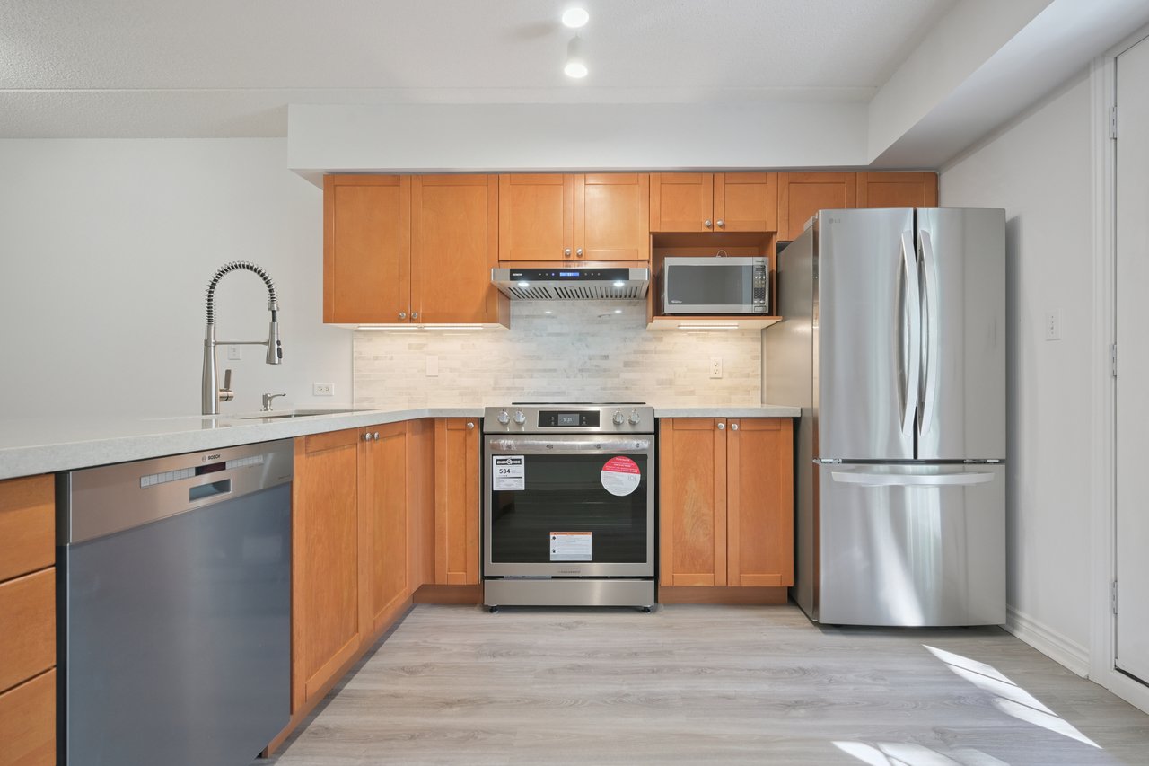 Upgraded 1 Bed+ Den Suite Overlooking Ravine