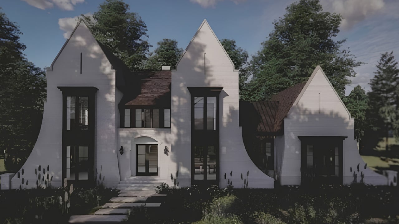 White custom home with steep gables, dark-framed windows, and a stone walkway.