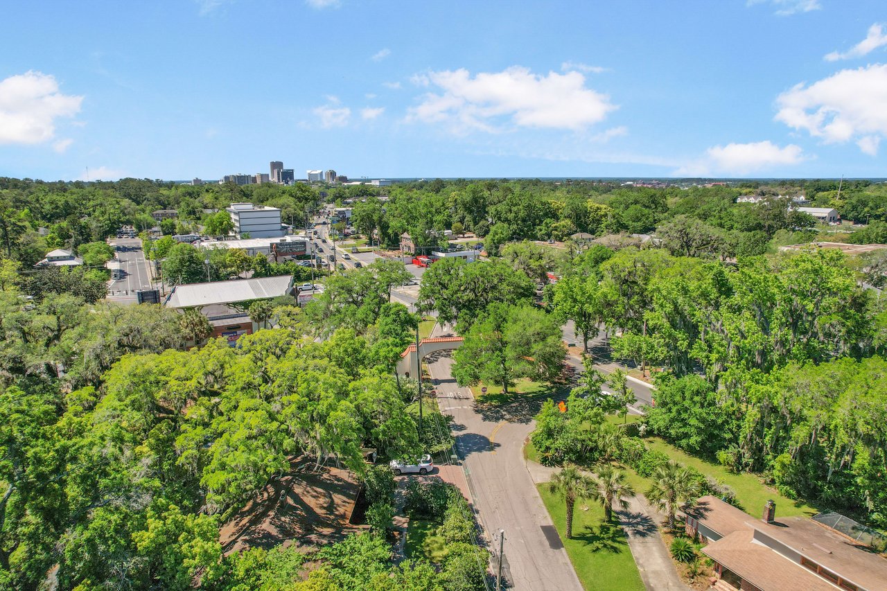 An aerial view of the Los Robles neighborhood, showing houses, streets, and tree cover.