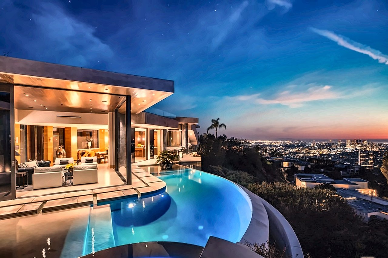Infinity pool and terrace overlooking Los Angeles city lights from a Hollywood Hills view home