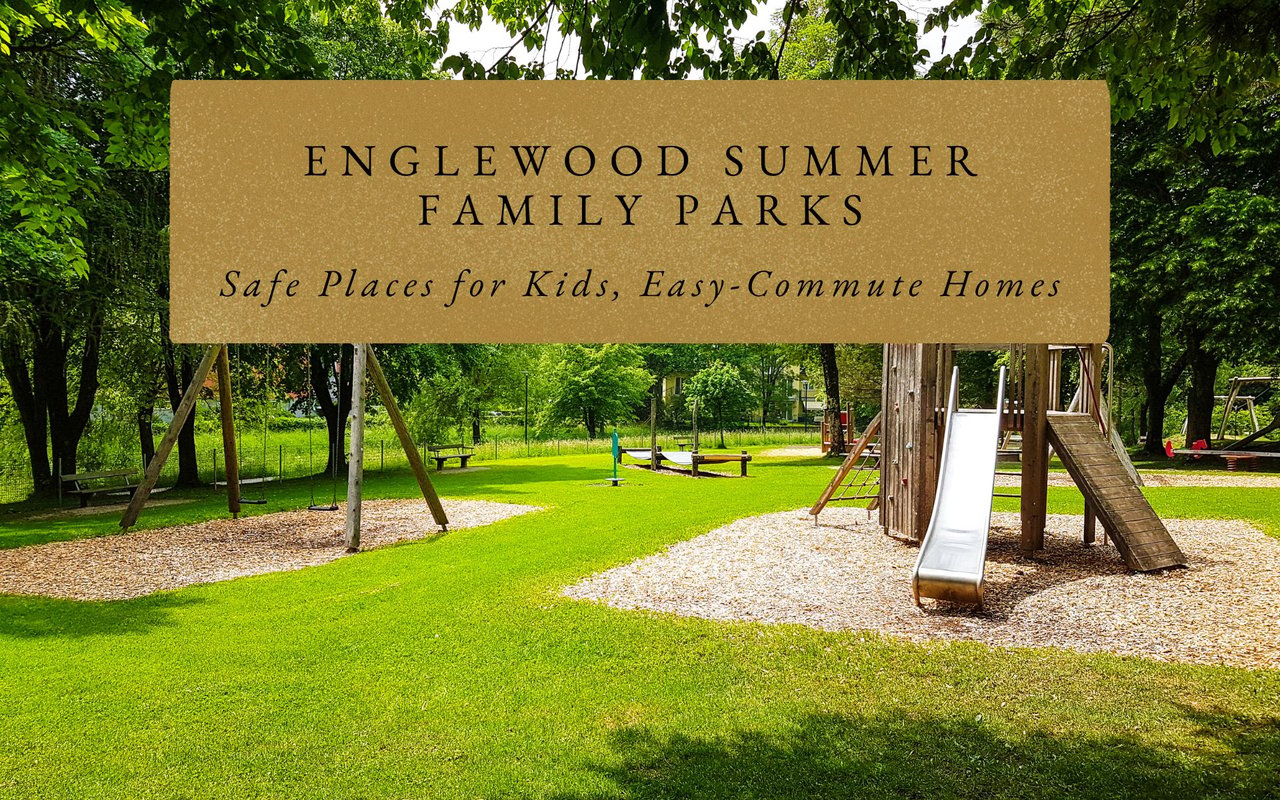 Small neighborhood park with a slide, swings, and benches, surrounded by single-family homes and mature trees.