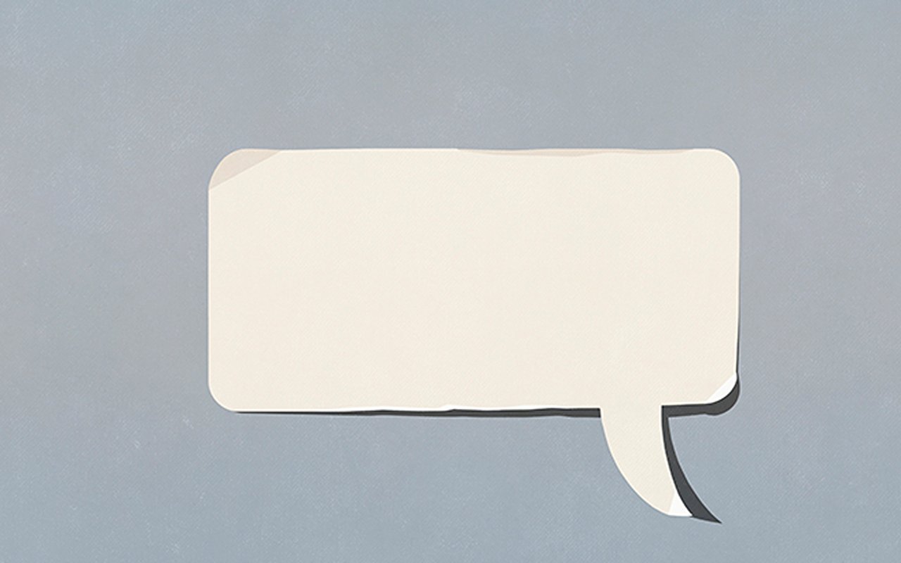 Blank cream speech bubble on a blue-gray background.
