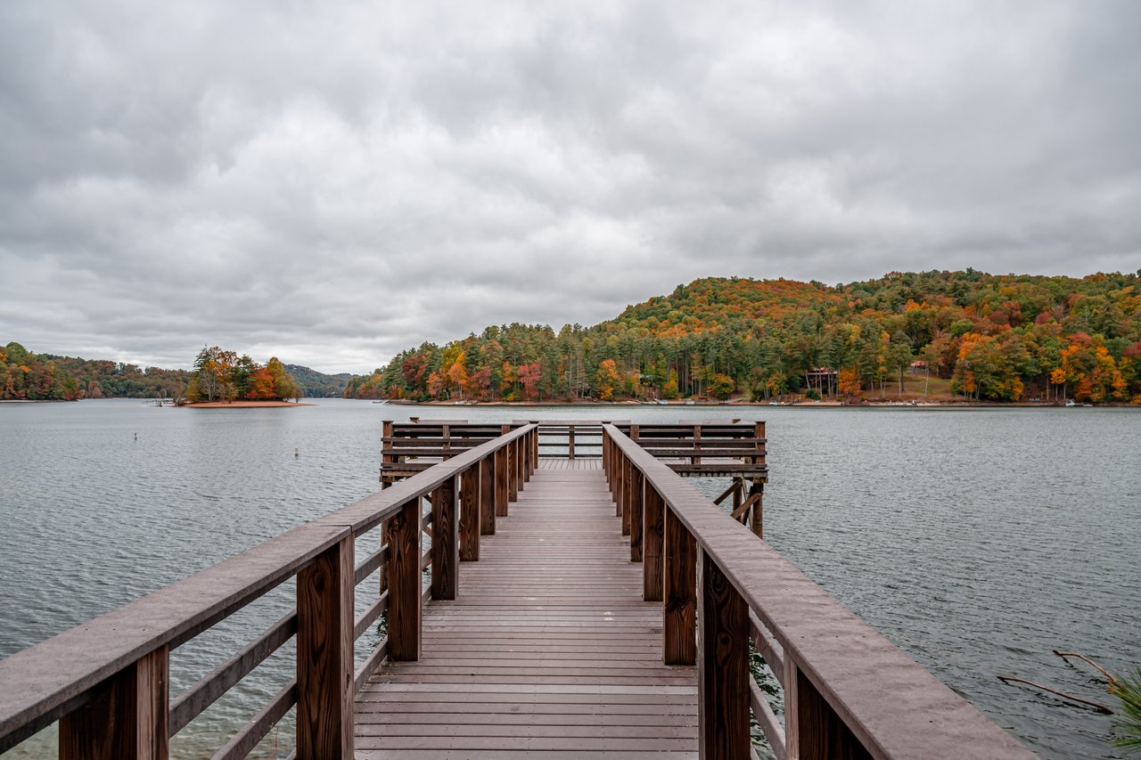 Wooden dock extending into Lake Glenville in Glenville North Carolina in fall