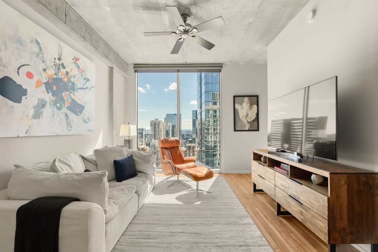 Luxury high-rise condominium at The Viridian in downtown Nashville featuring panoramic skyline views, modern architecture, and an upscale urban lifestyle near Broadway, restaurants, and entertainment.