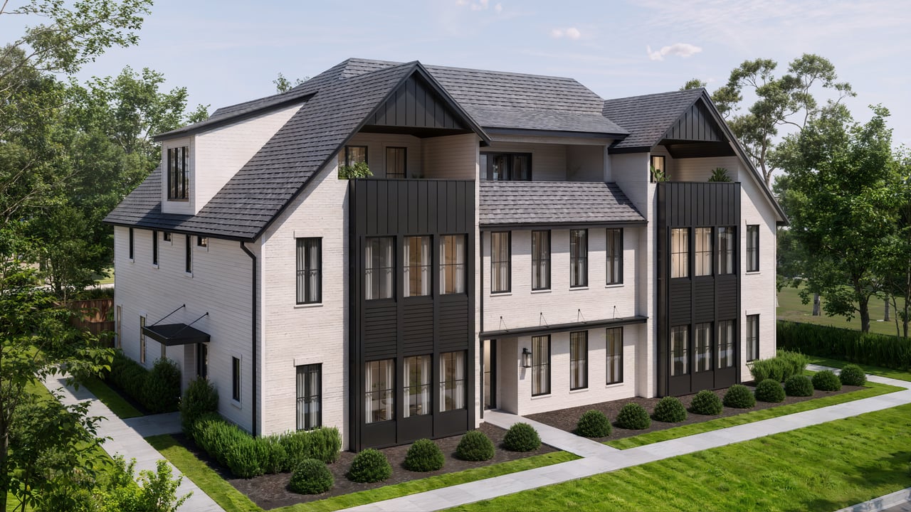Multi-unit residential building with white siding, dark gabled roofs, black balconies, and landscaped grounds.