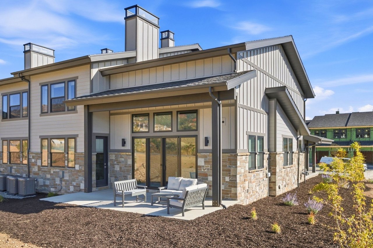 New Mayflower Lakeside townhome with covered patio and stone exterior near the Jordanelle Reservoir