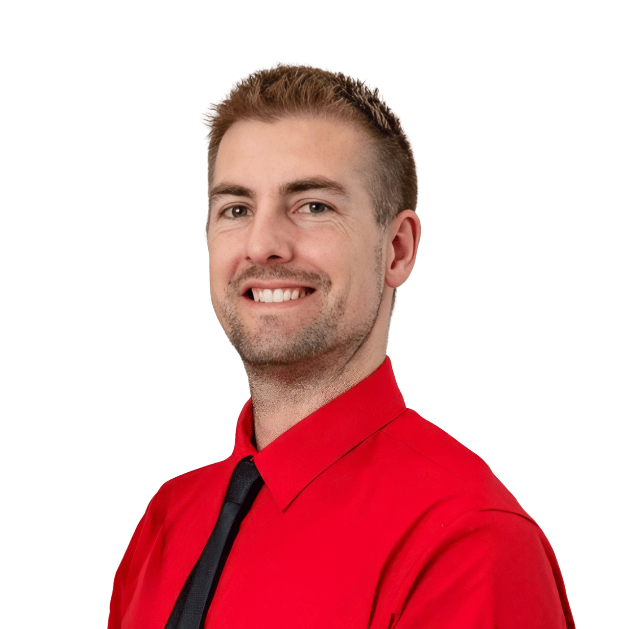 Ben Vidovich smiling in a red shirt and black tie.