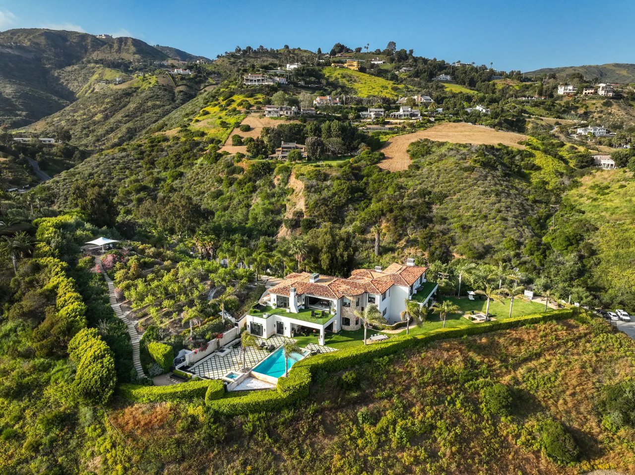 Scorched Malibu lot that once housed Gigi and Bella Hadid’s childhood home sells for a record $6.5M
