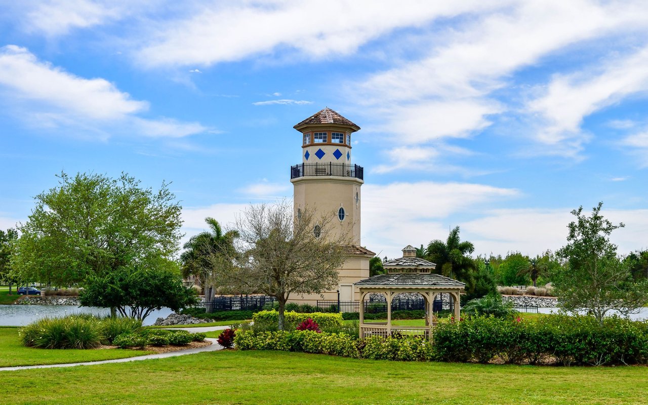 Heritage Harbour community tower and gazebo beside a pond and landscaped grounds.