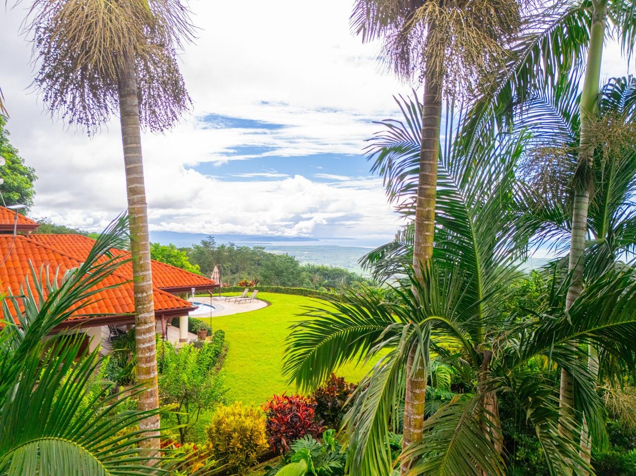 Ocean, jungle & mountain views on a meticulously landscaped 3-home family compound