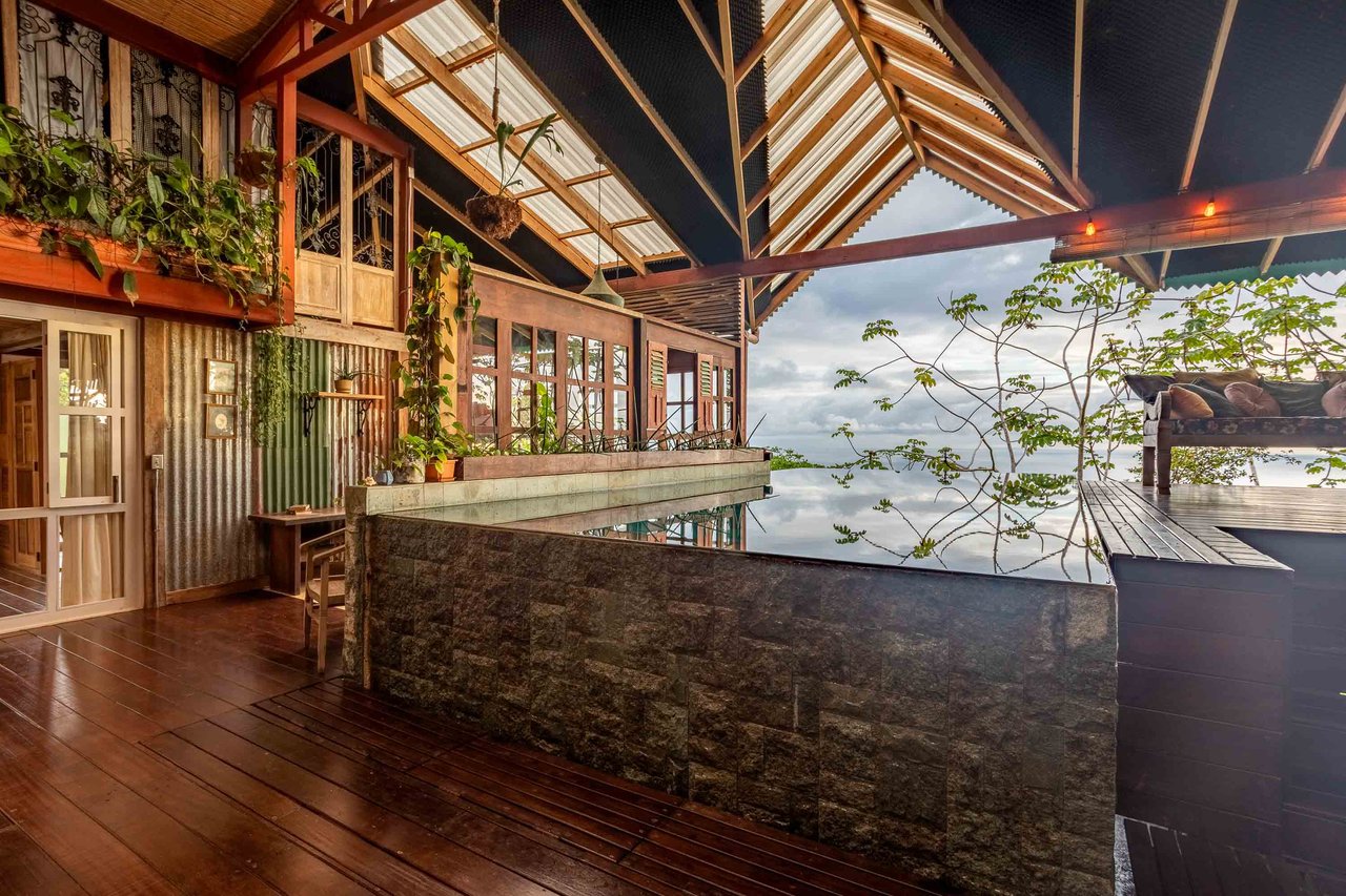 A Handcrafted Residence Immersed in Nature Above the Canopy Ocean View Architectural Home