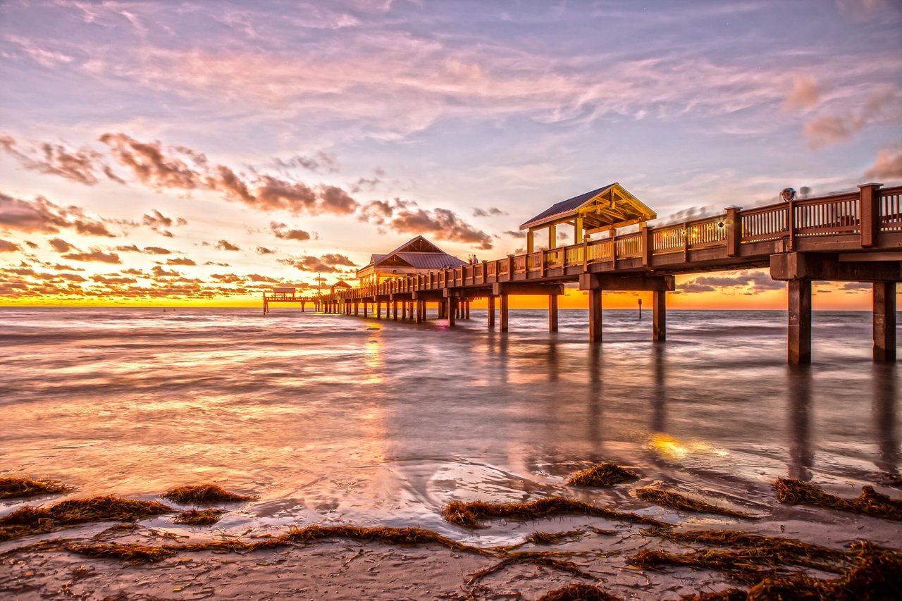 Sunset over Clearwater Beach with soft white sand and vibrant sky, a top Tampa weekend getaway spot