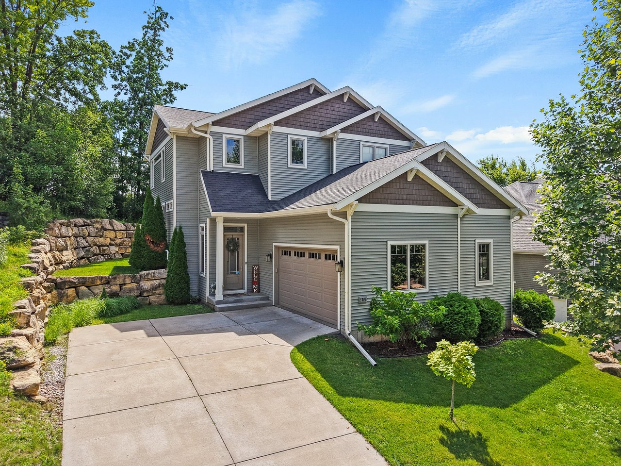 Front exterior of a move-in ready home at 1709 Sawtooth Trail in Madison, WI with landscaped yard and two-car garage.