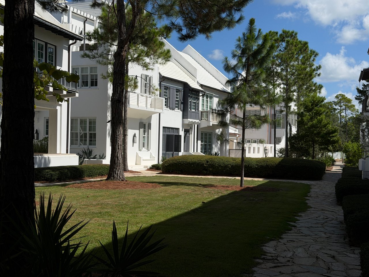 Landscaped residential area with white luxury homes in Alys Beach Florida
