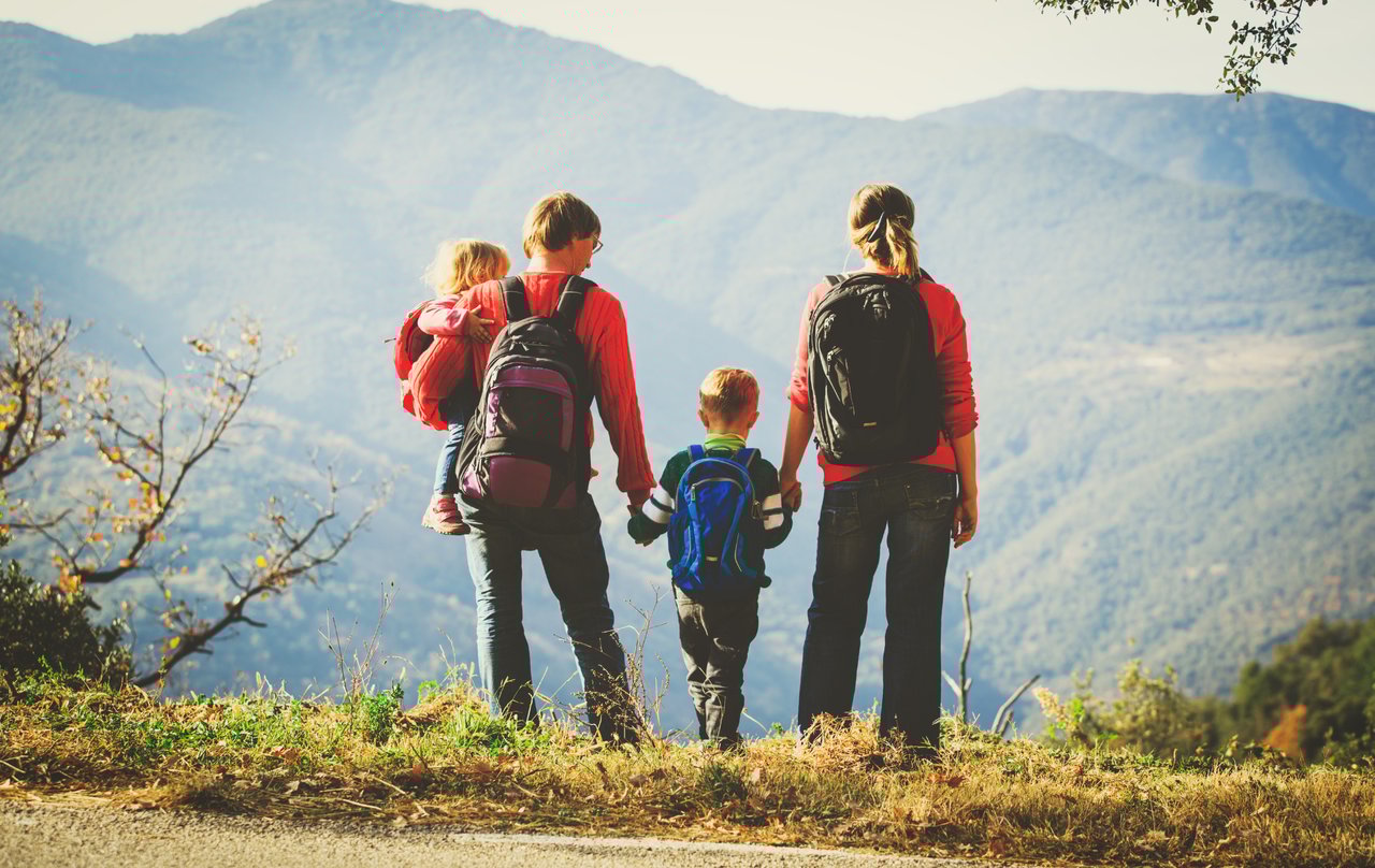 Family hiking on a scenic trail near Denver during spring break