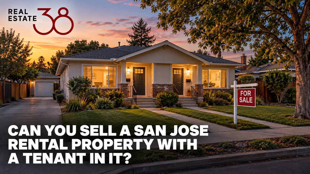 San Jose duplex rental home with a for sale sign, windows lit at dusk