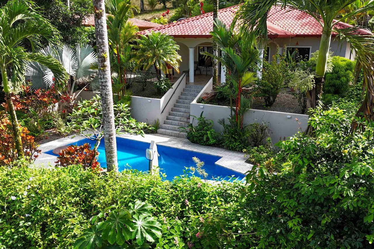 Turnkey Spacious Home with Open Layout, Pool & Small Ocean View in Ojochal Gated Community