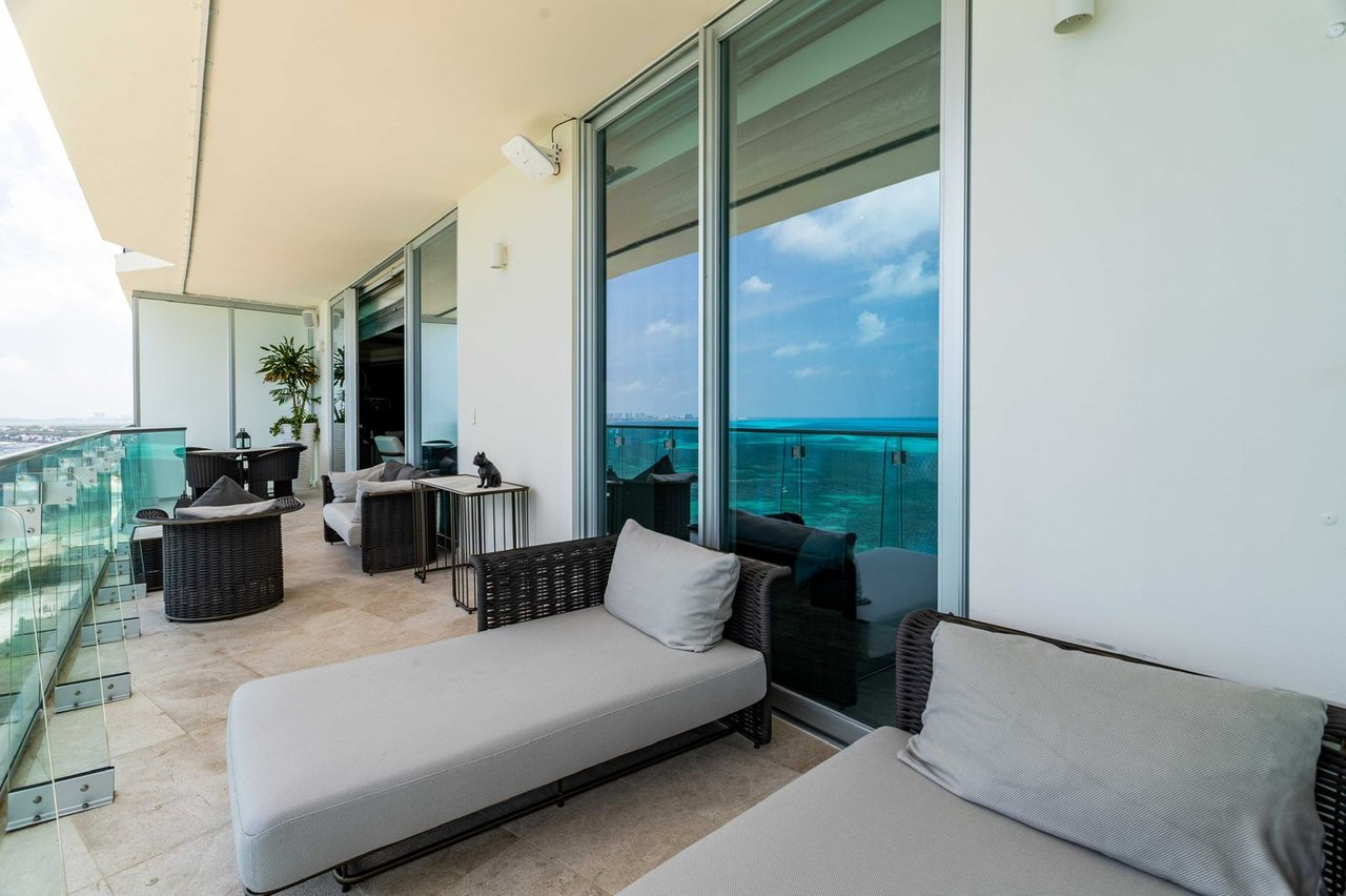 LUXURIOUS and STUNNING apartment featuring OCEAN VIEWS from the living room, primary bedroom, and terrace, with BEACHFRONT access in Cancun's most upscale area