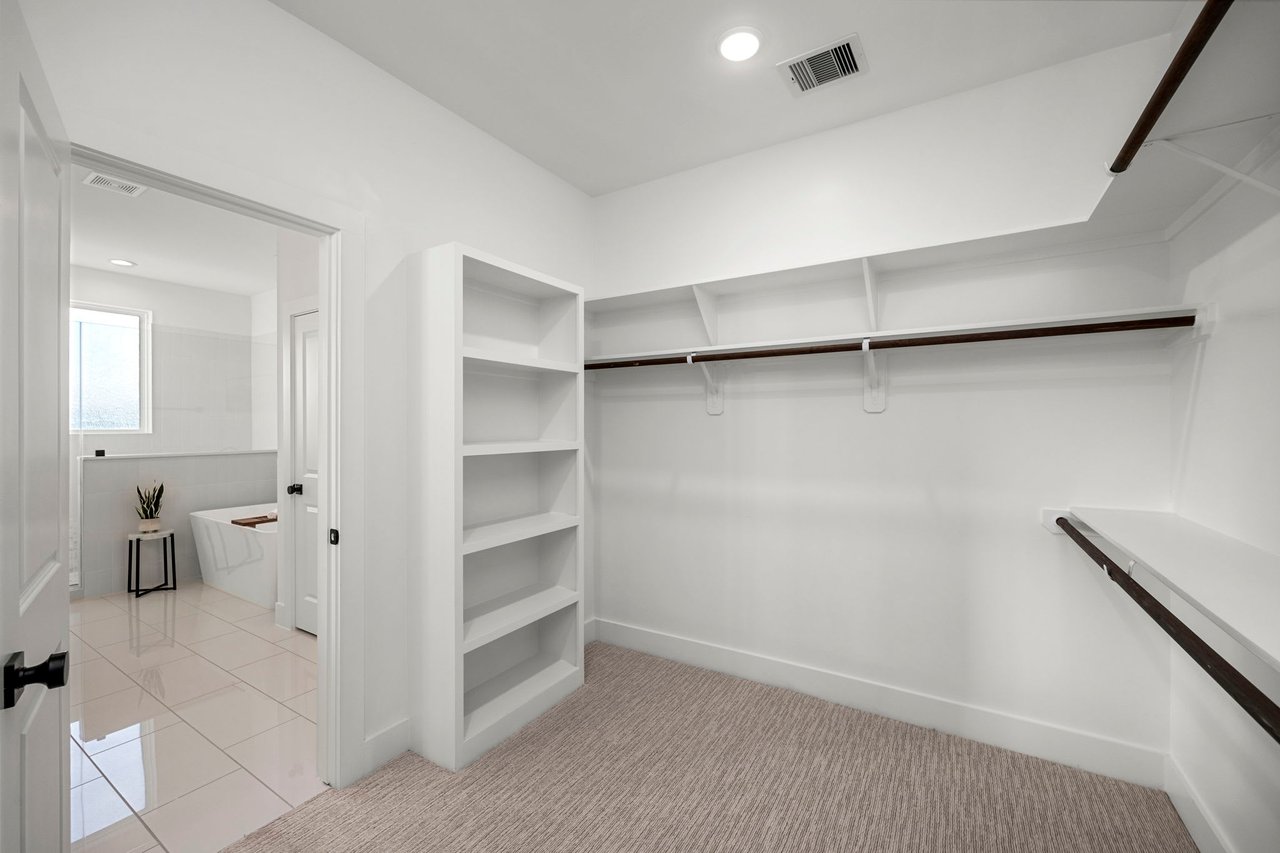 large walk-in closet off of the bathroom