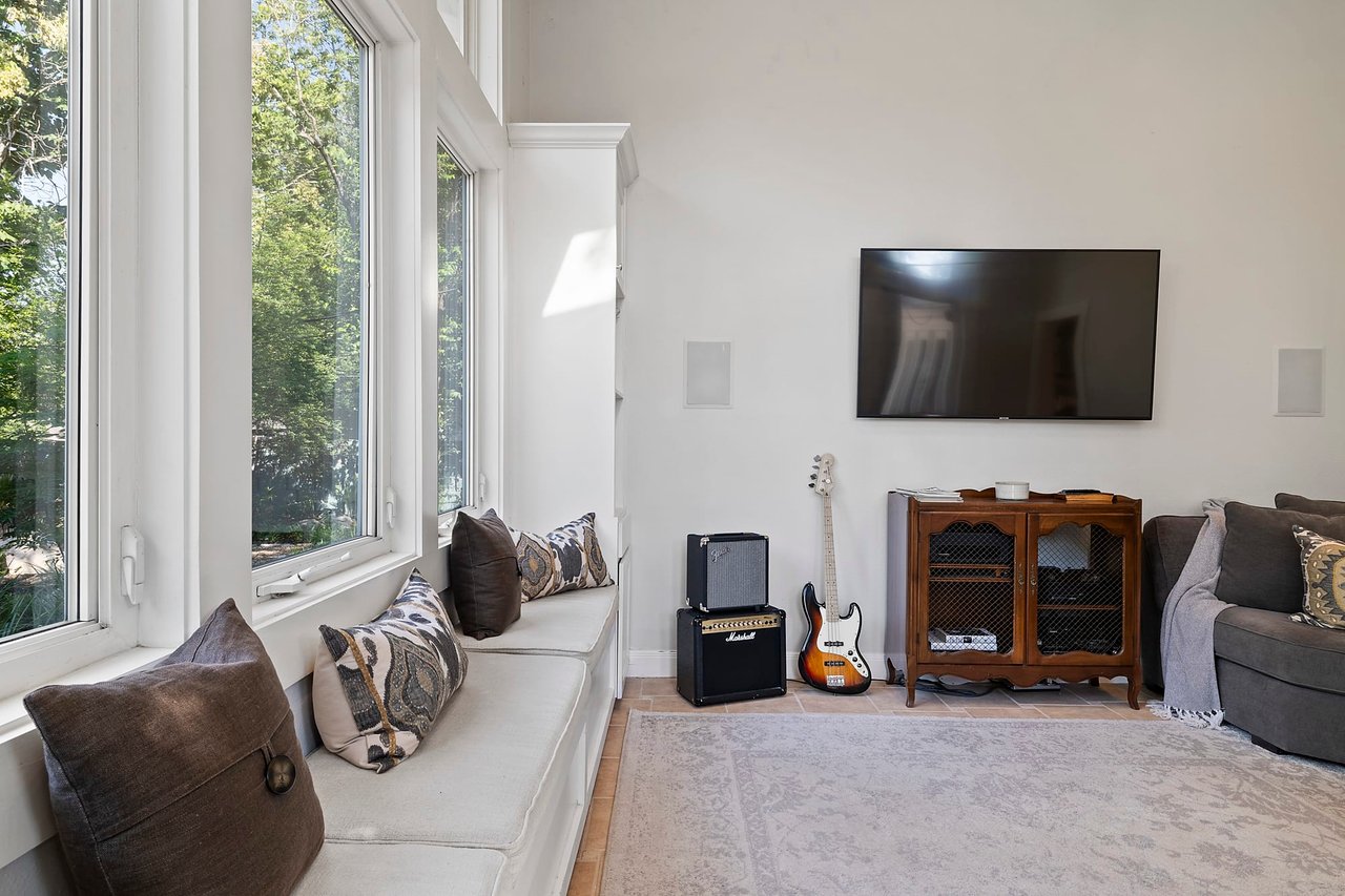 Family room window seat detail with pillows, 2404 Westover Rd, Tarrytown.