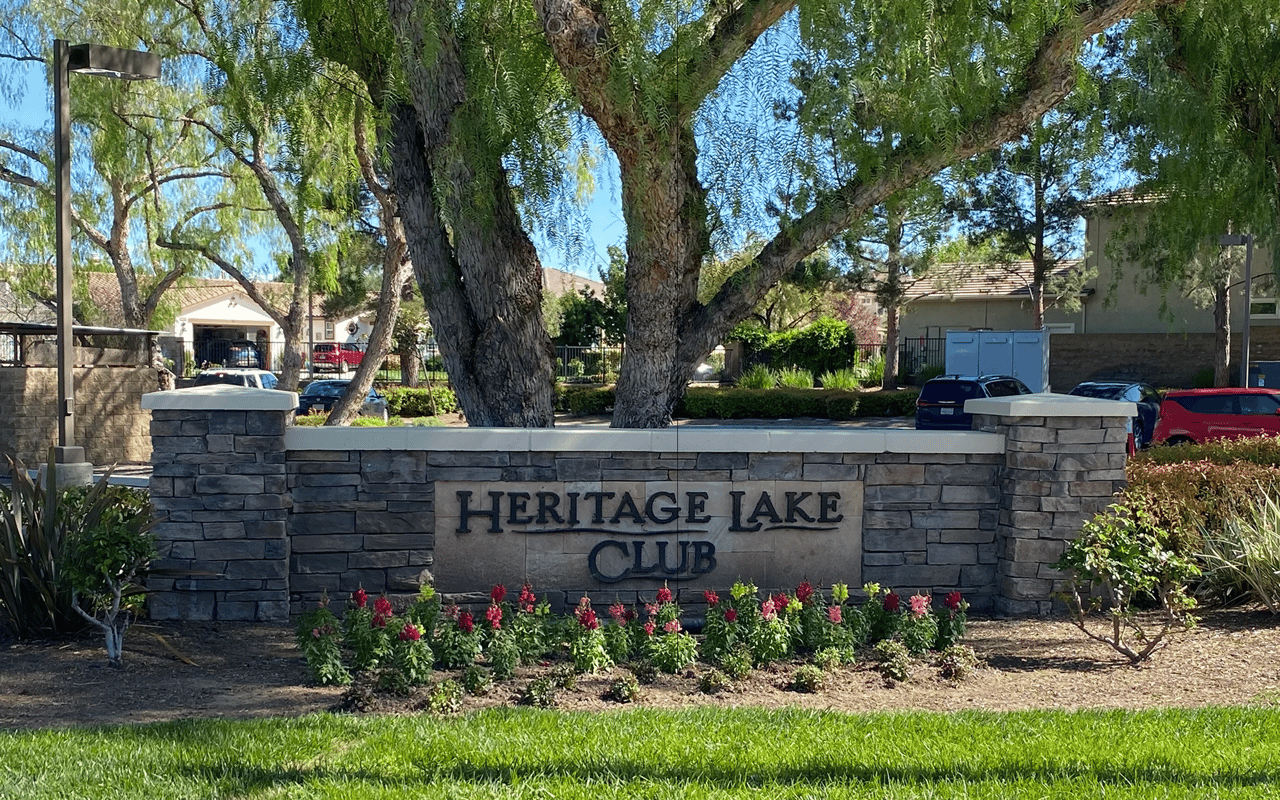 The entrance to the resort-style Heritage Lake Club, offering exclusive amenities for residents in Menifee, CA.