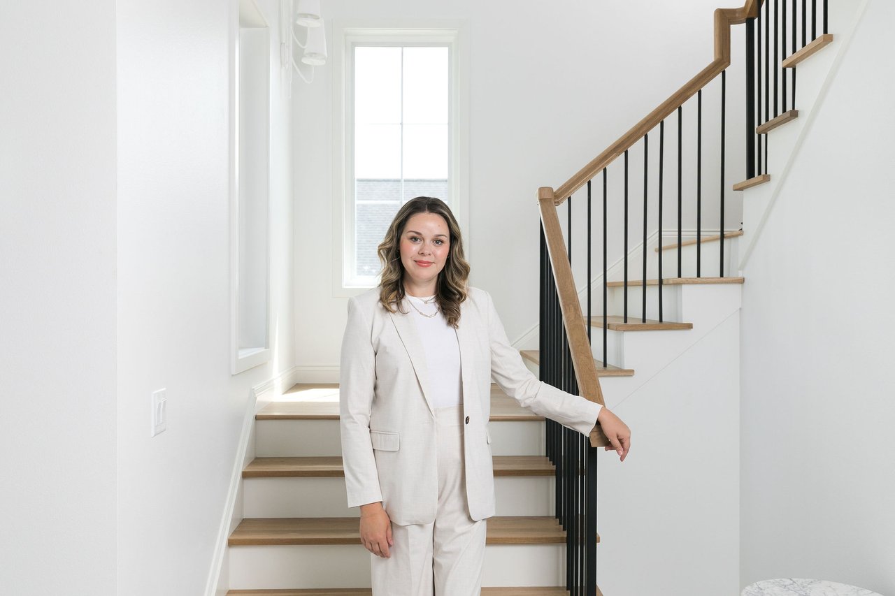 Cait Berry of Insiders Realty standing in a bright, professionally prepared Madison home, representing the preparation-first approach she brings to listing strategy and home prep for Madison-area sellers.