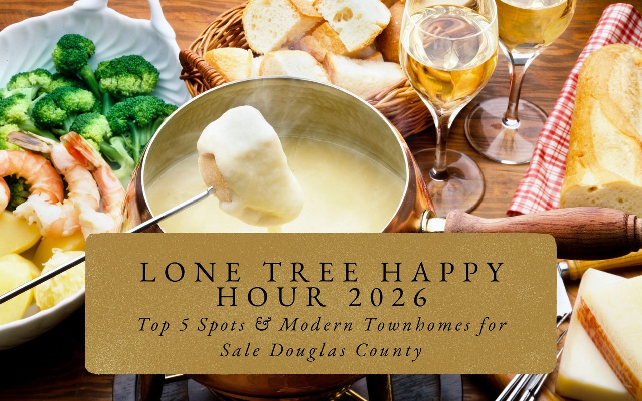 Elegant fondue pot bubbling with cheese at Melting Pot during Lone Tree happy hour, wine glasses glowing amber.