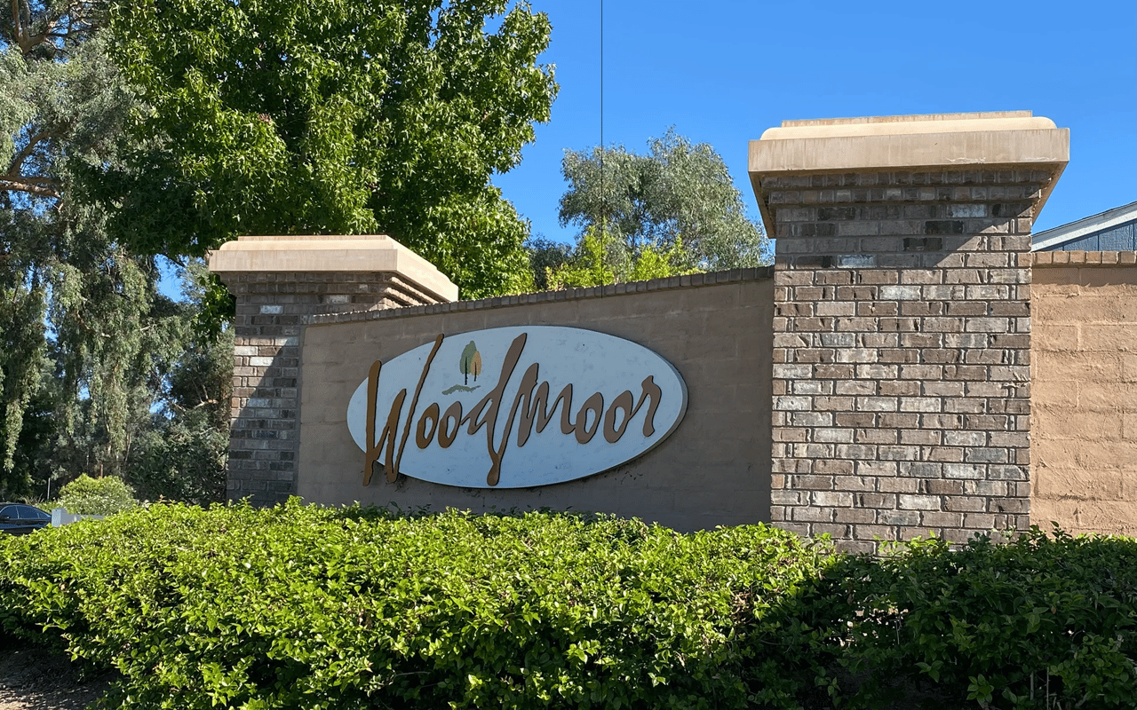 The landscaped entrance sign for the Woodmoor neighborhood in Wildomar, California.