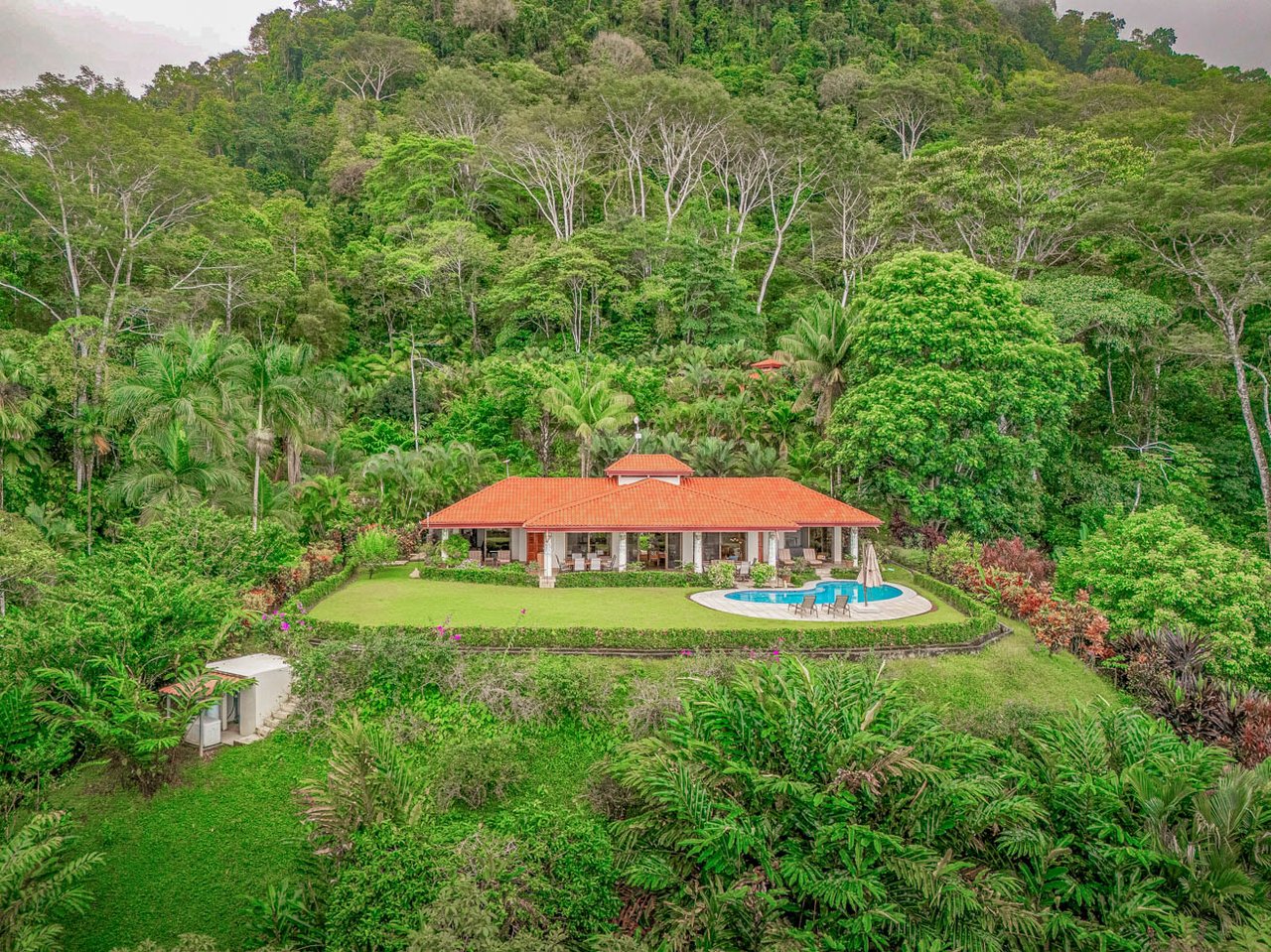 Ocean, jungle & mountain views on a meticulously landscaped 3-home family compound