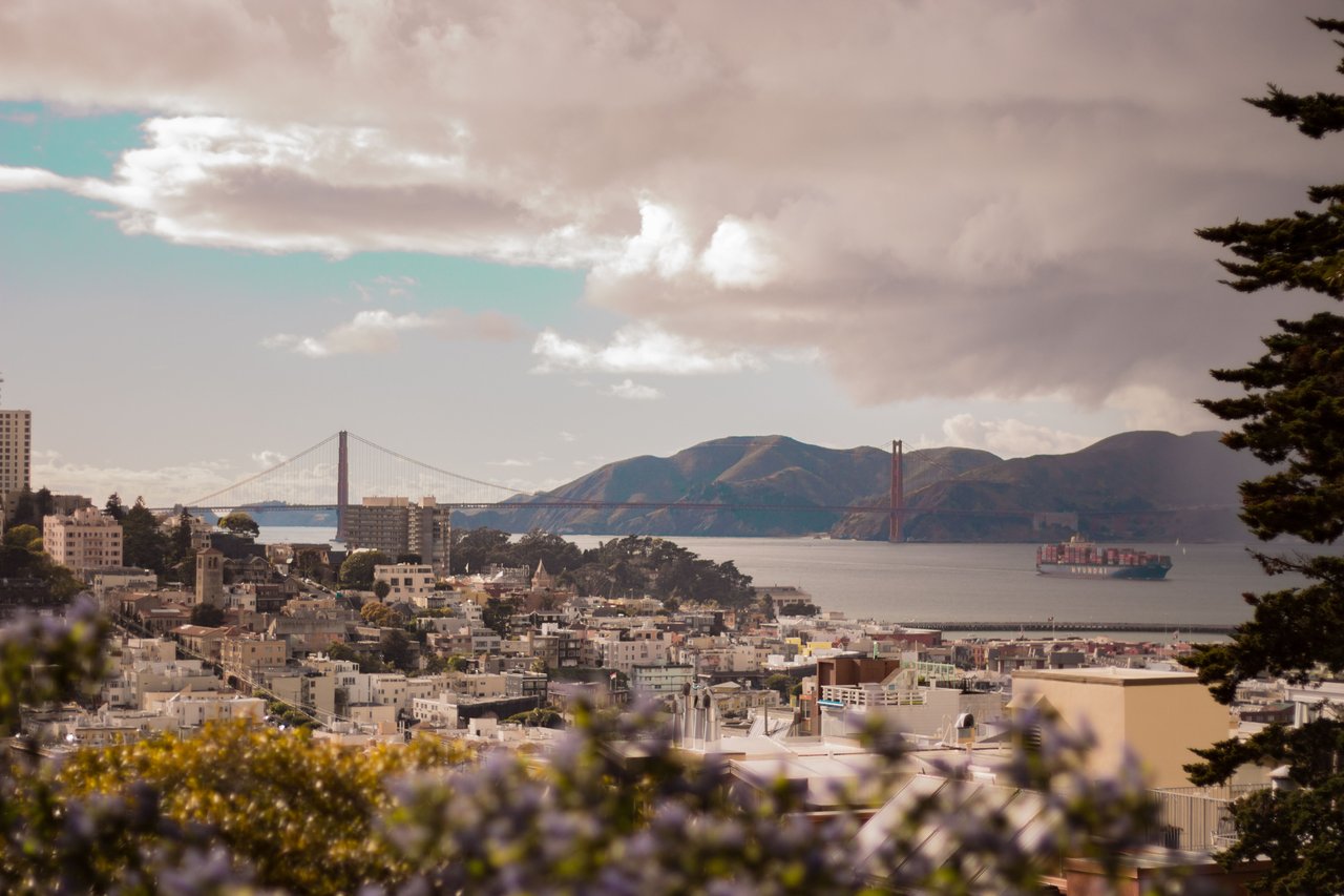 San Francisco and Marin hillside homes with waterfront views, representing summer and fall real estate timing.