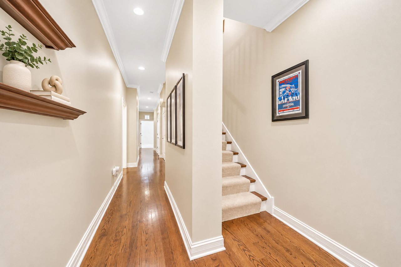 Main-floor hallway with stairs to the lower level