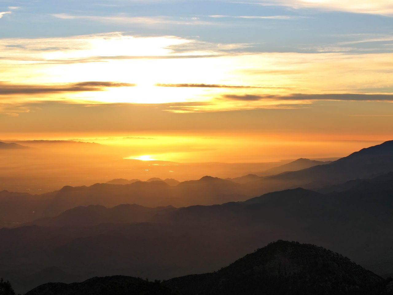 Coachella Valley desert mountain and palm landscape under clear sky, August market report hero