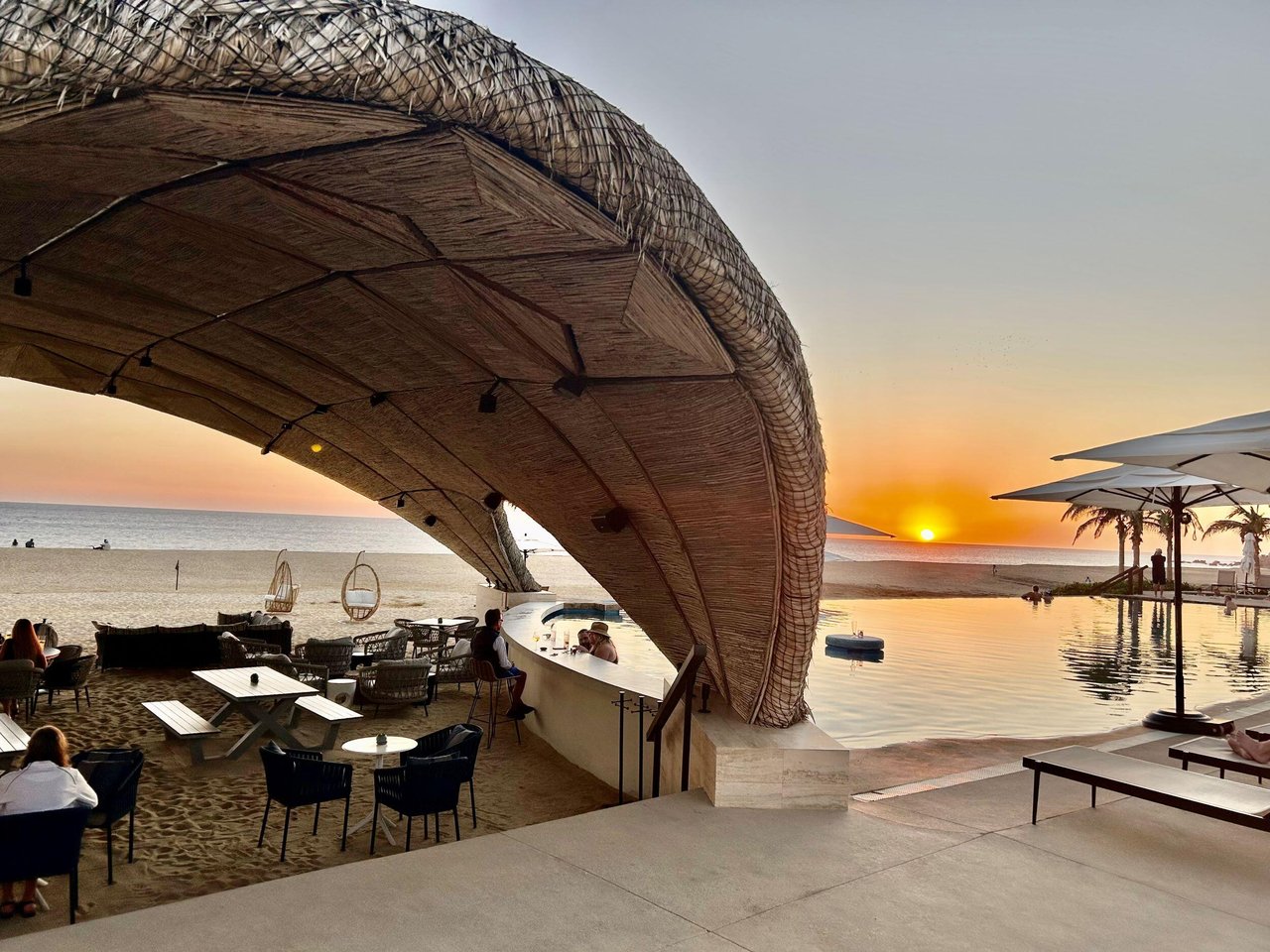 Quivira beach club infinity pool and lounge at sunset