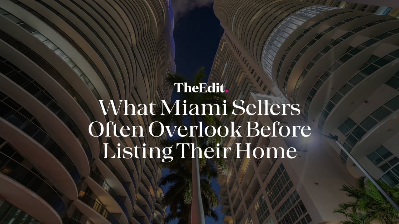 Upward view of modern Miami luxury condominium towers at twilight with palm trees, illustrating The Edit Real Estate's guide on what Miami sellers overlook before listing their home