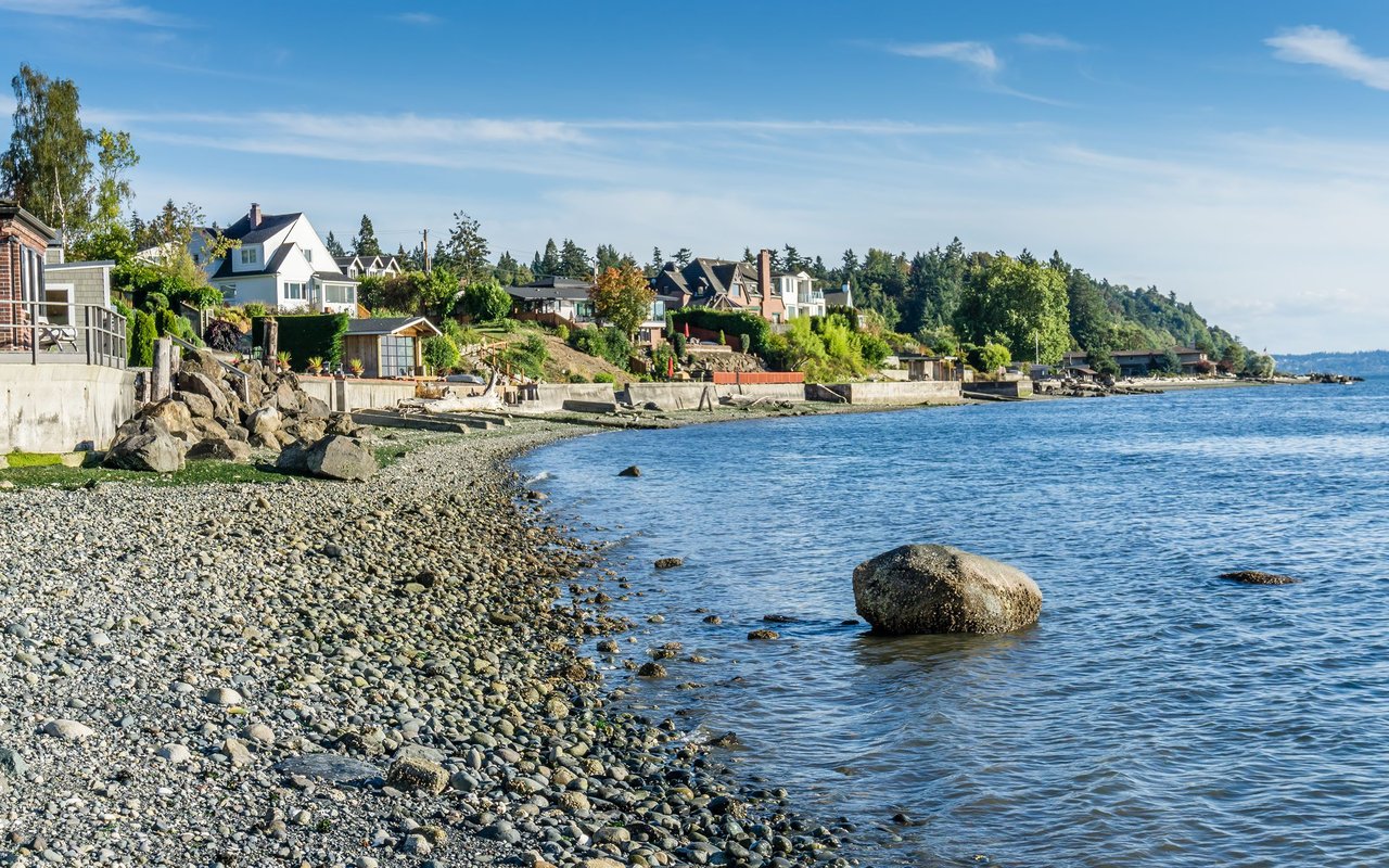 Normandy Park waterfront homes along a rocky shoreline.